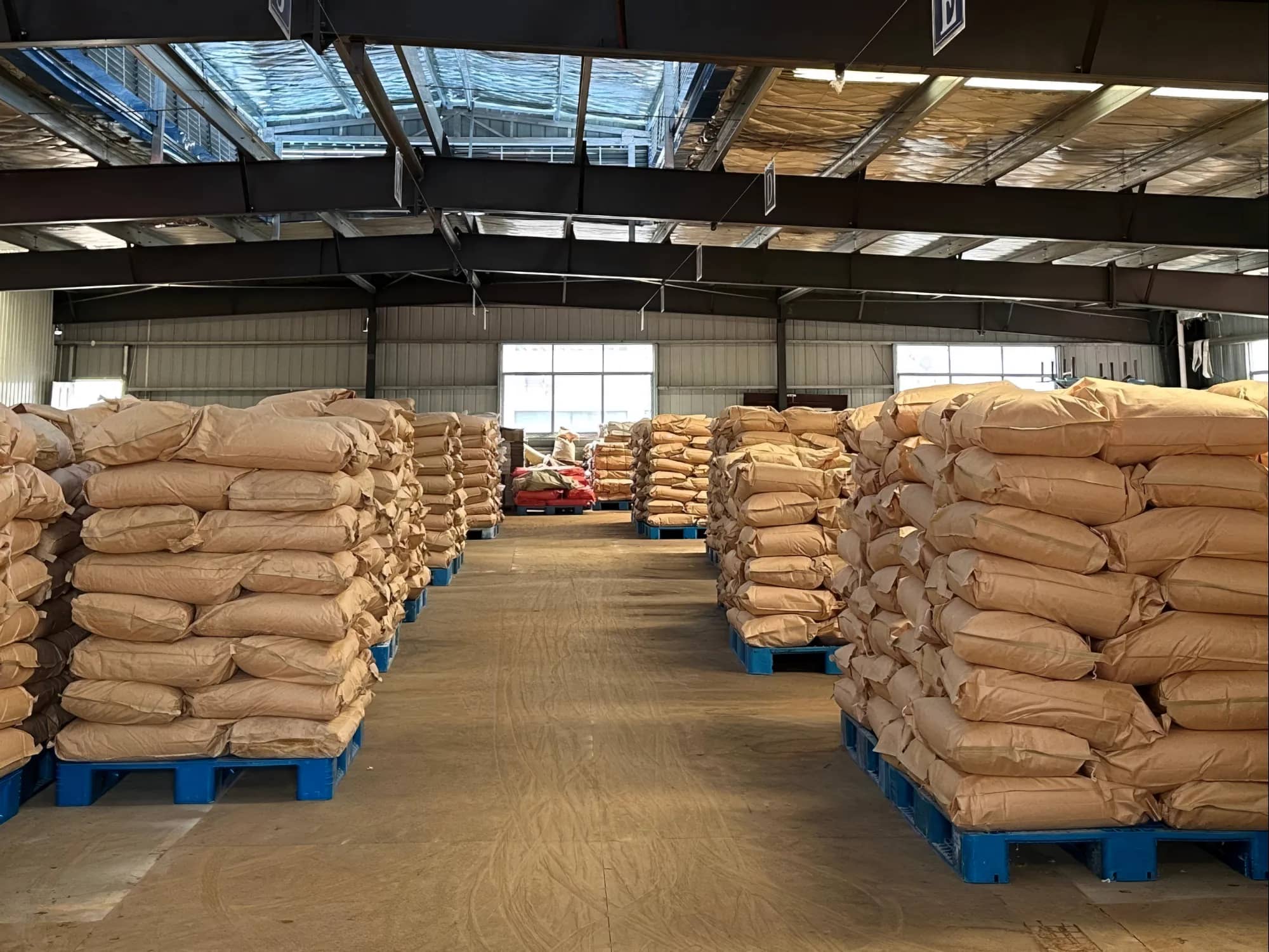 Palletised 25 kg kraft bags in a warehouse